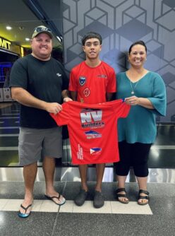 Traejorn Cora with NV Builders sponsors before the 2024 Touch World Cup in England