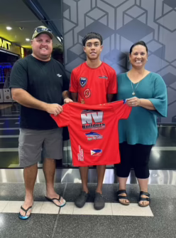 Traejorn Cora Traejorn Cora with NV Builders sponsors before the 2024 Touch World Cup in England