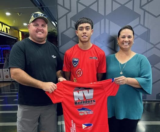 Traejorn Cora with NV Builders sponsors before the 2024 Touch World Cup in England